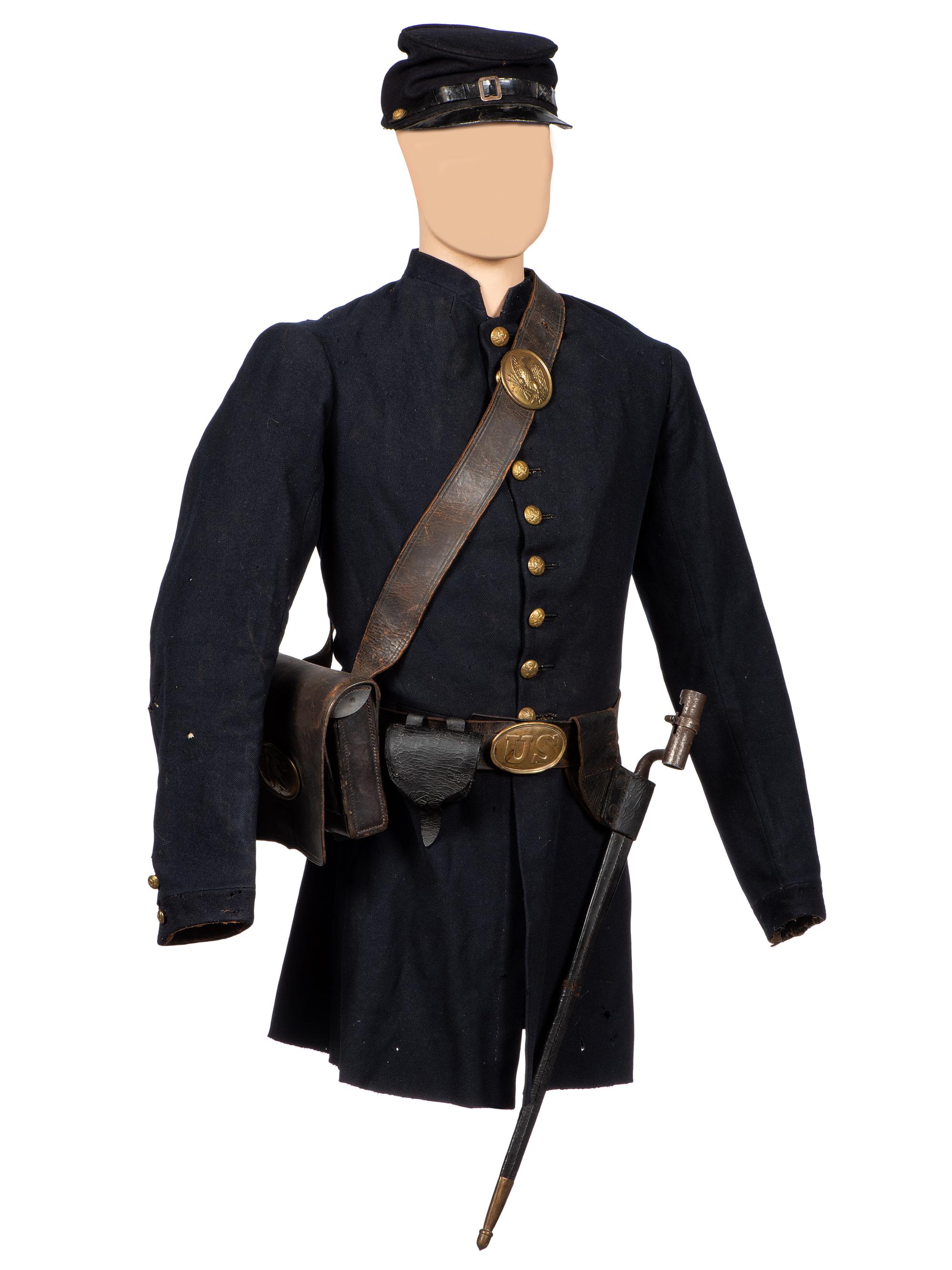 [CIVIL WAR]. A collection of items attributed to Thomas W. Johnson, Co. K, 4th Delaware Infantry, incl. frock coat, cap, belt rig, and cartridge box.