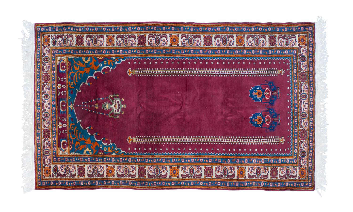A Persian Prayer Rug 6 feet 4 inches x 3 feet 9 inches.