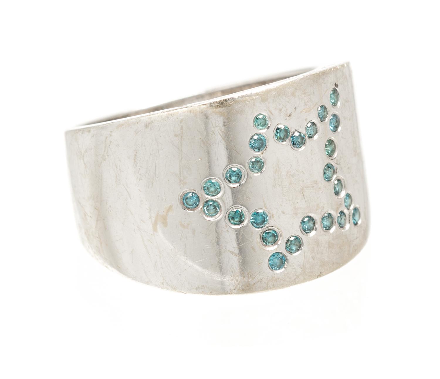 An 18 Karat White Gold and Colored Diamond Star Motif Ring, 4.30 dwts.