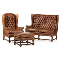 A Set of Leather Upholstered Button Tufted Wingback Sofas and Armchair