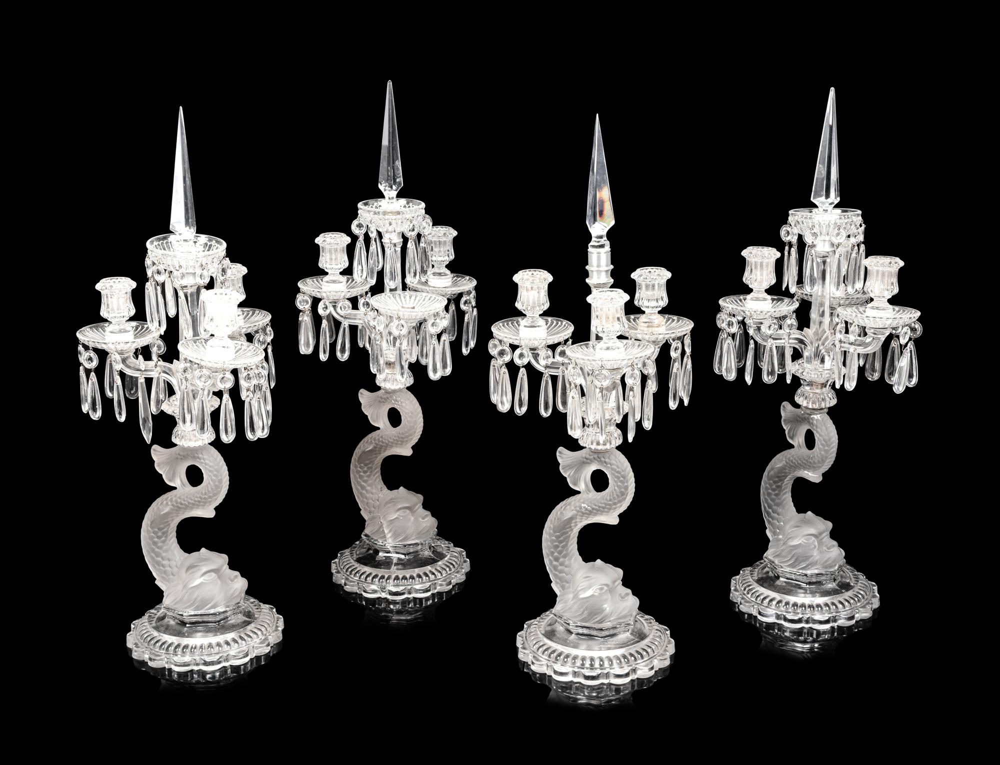 A Set of Four Baccarat Dauphin Three-Light Candelabra