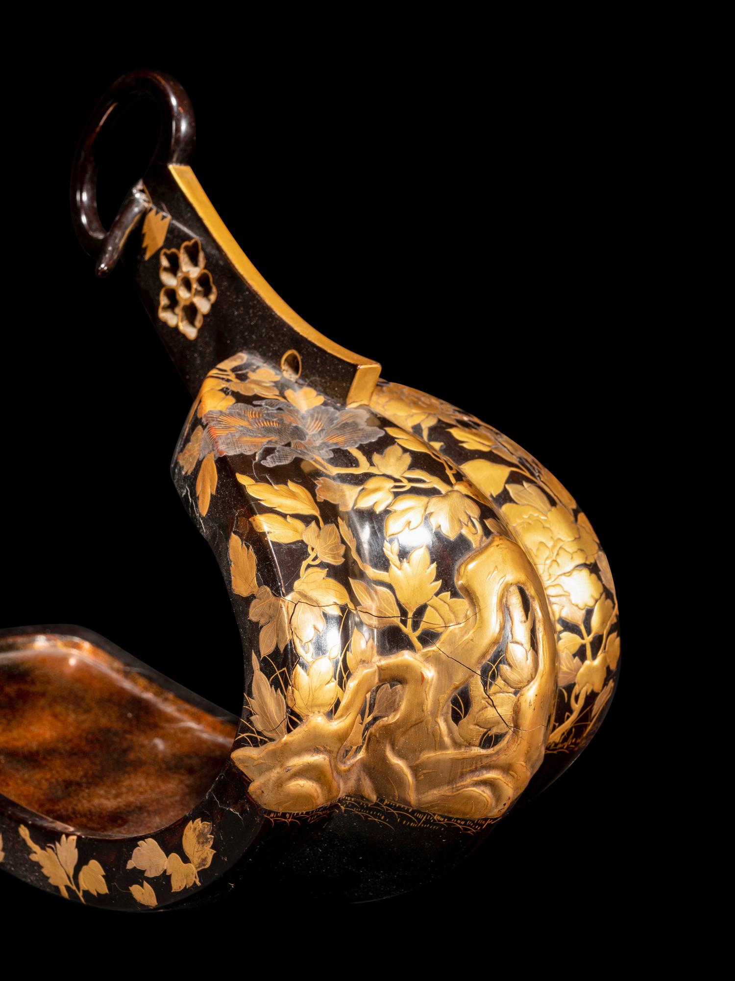 A Pair of Japanese Gold and Black Lacquered Stirrups