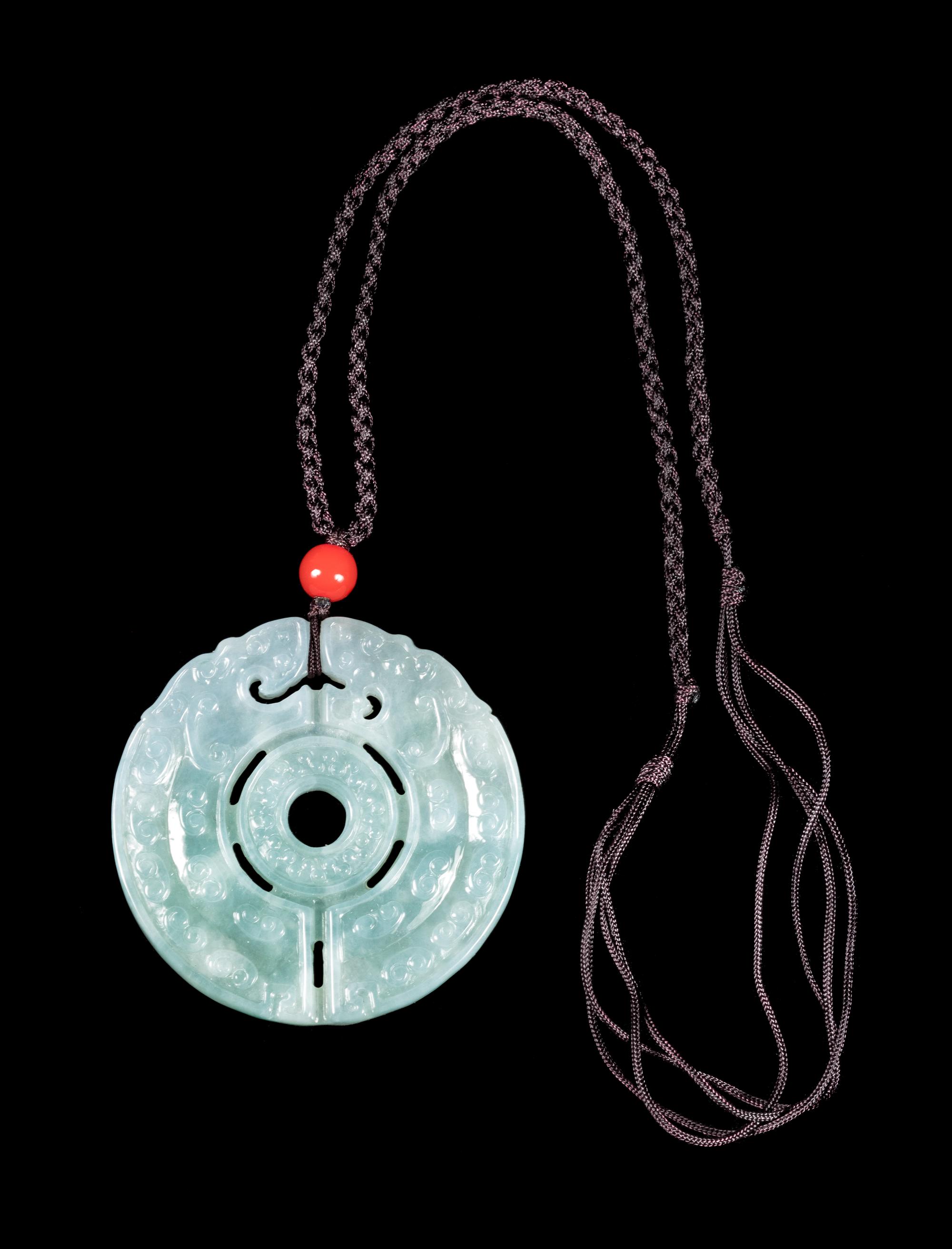 A Jadeite Pendant of Double Dragons Diameter 2 1/4 inches. — 20TH CENTURY