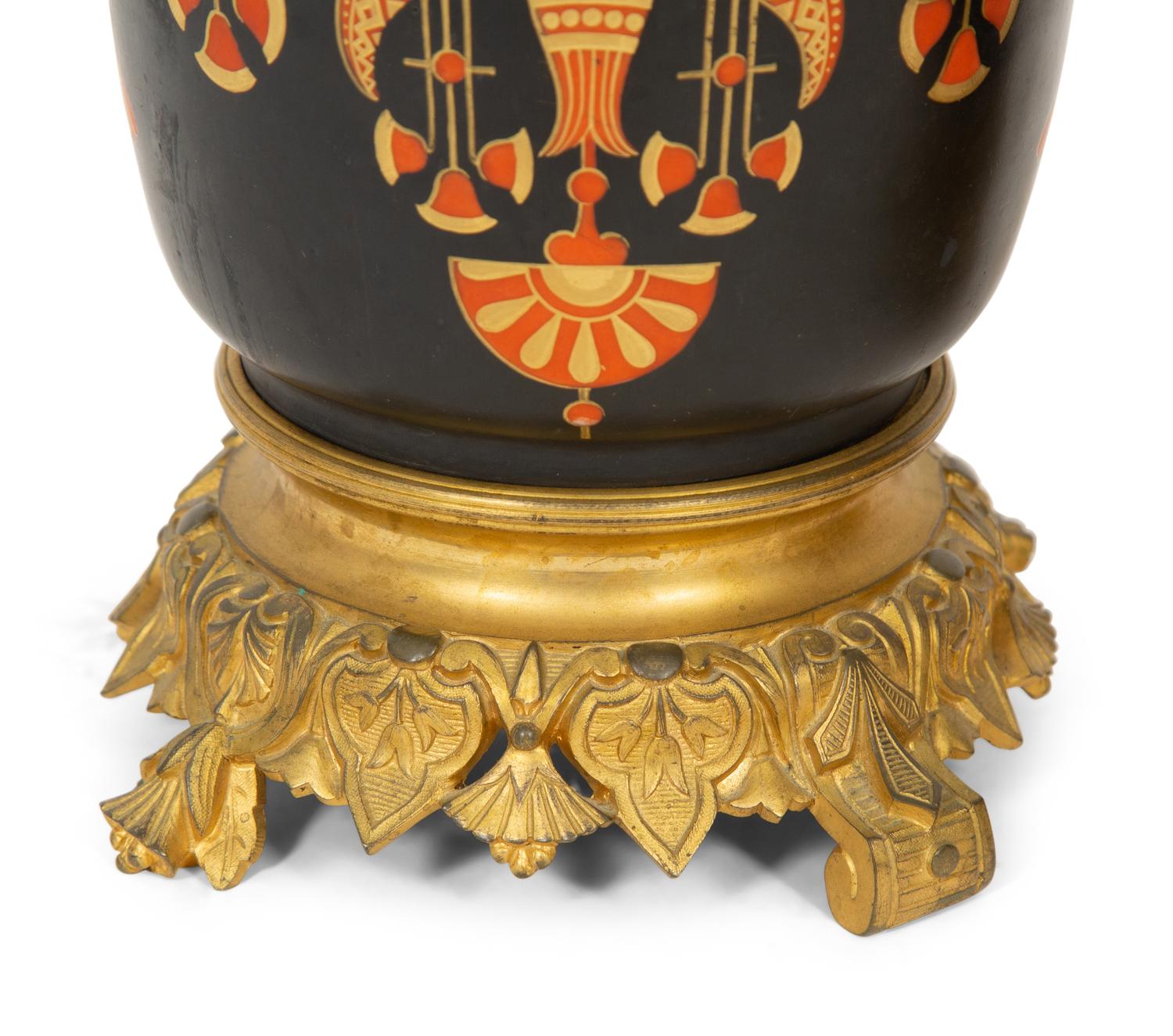 A Pair of French Egyptian Rivival Gilt Bronze Mounted Porcelain Cache Pots