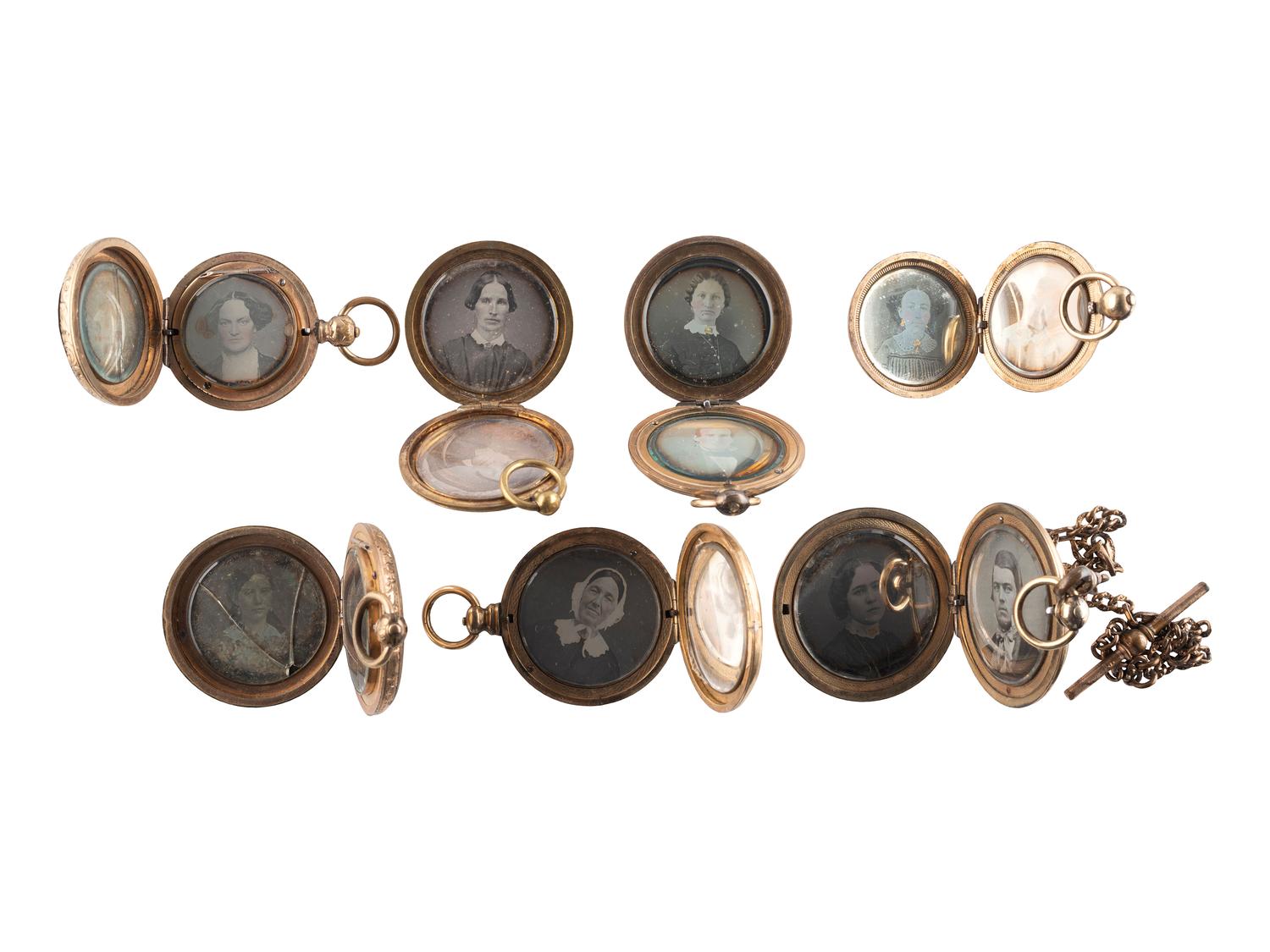 [EARLY PHOTOGRAPHY]. A group of 7 lockets containing 15 daguerreotype portraits.