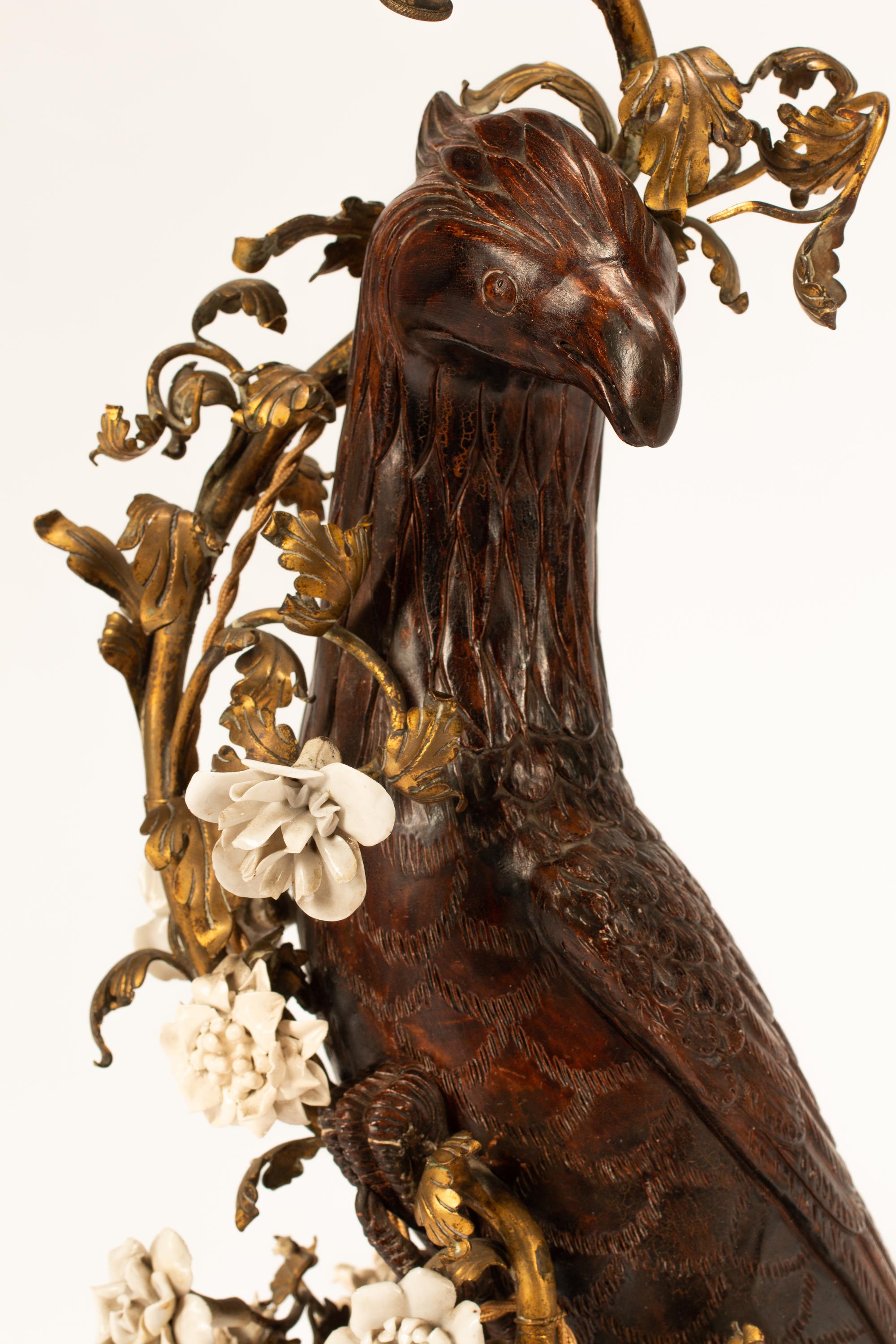 A German Gilt Bronze, Porcelain and Lacquered Wood Model of a Bird Mounted as a Lamp