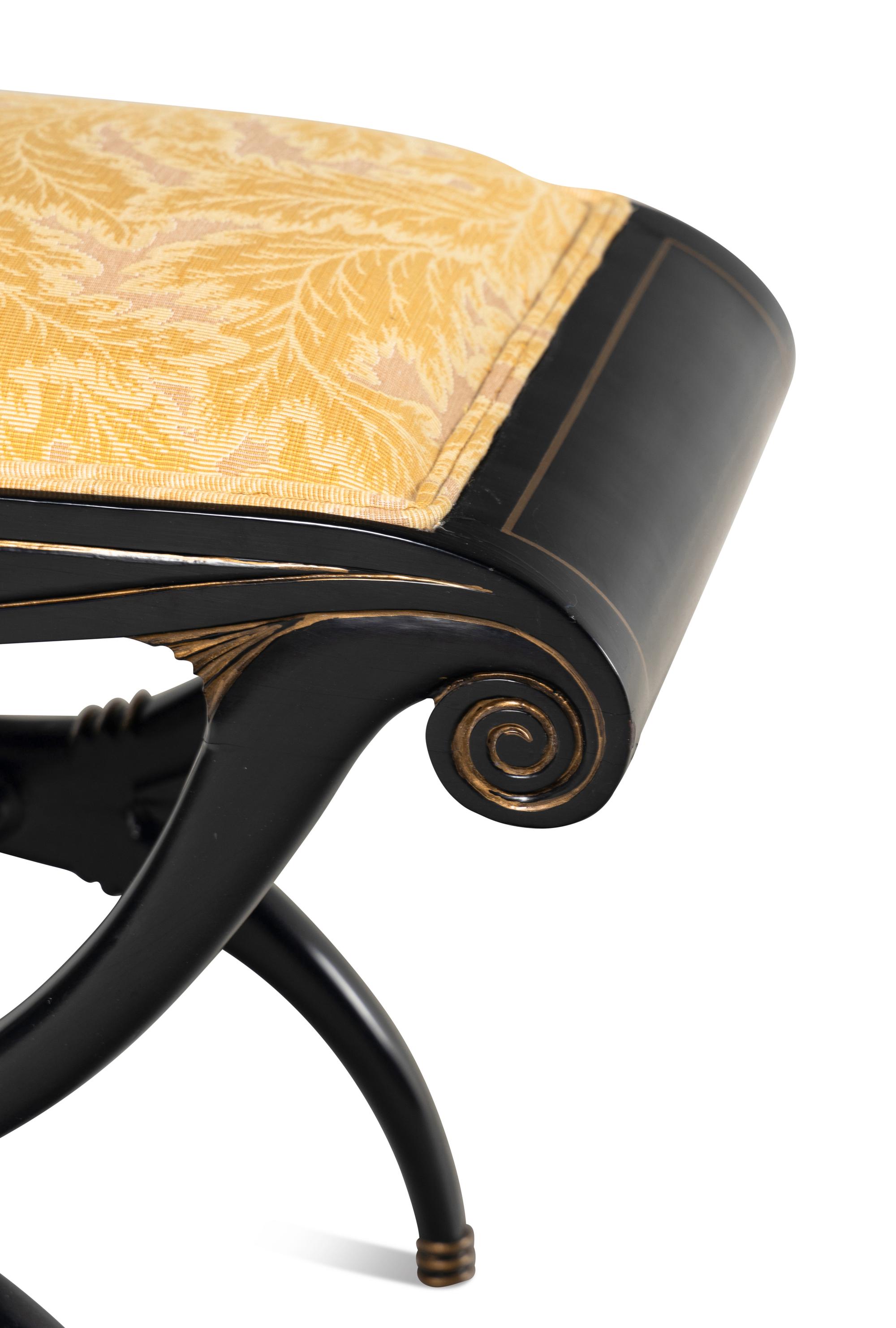 A Regency Style Black and Gilt Decorated Curule Form Stool