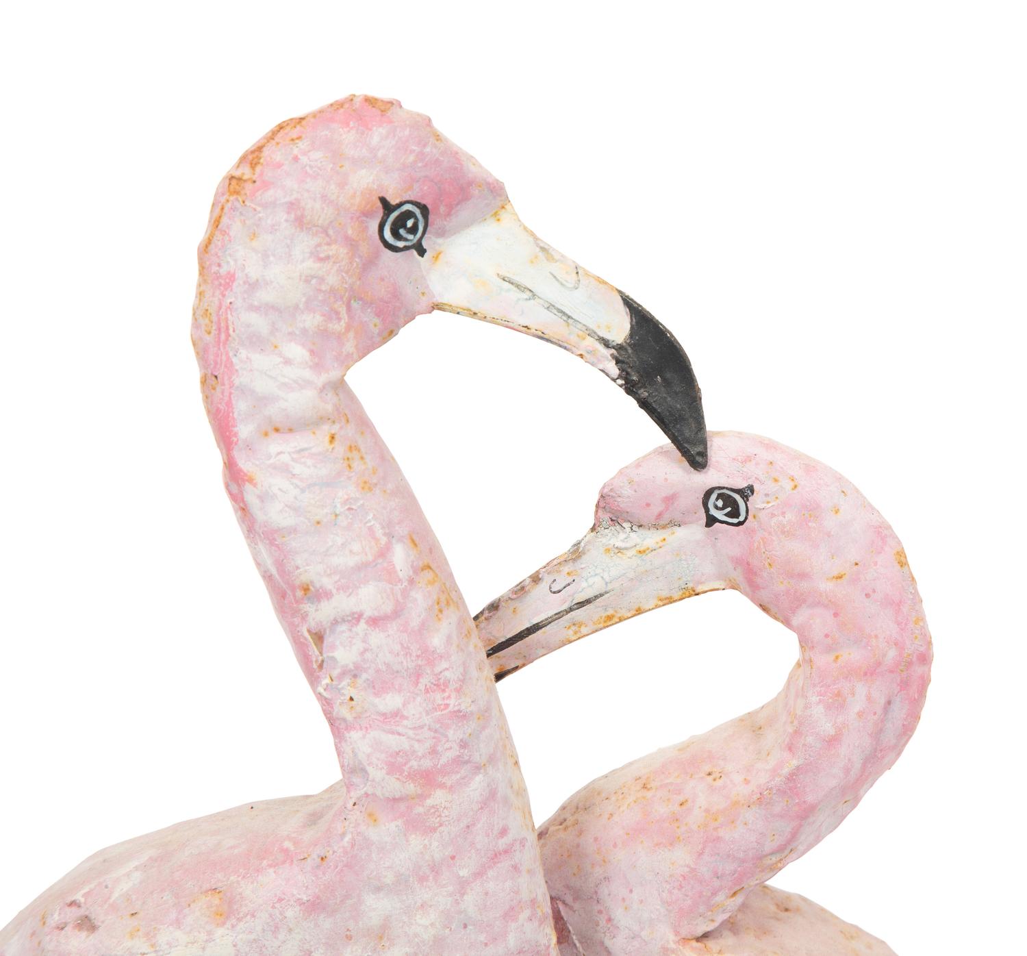 A Tole Peint Model of Two Flamingos and a Glazed Earthenware Model of a Flamingo