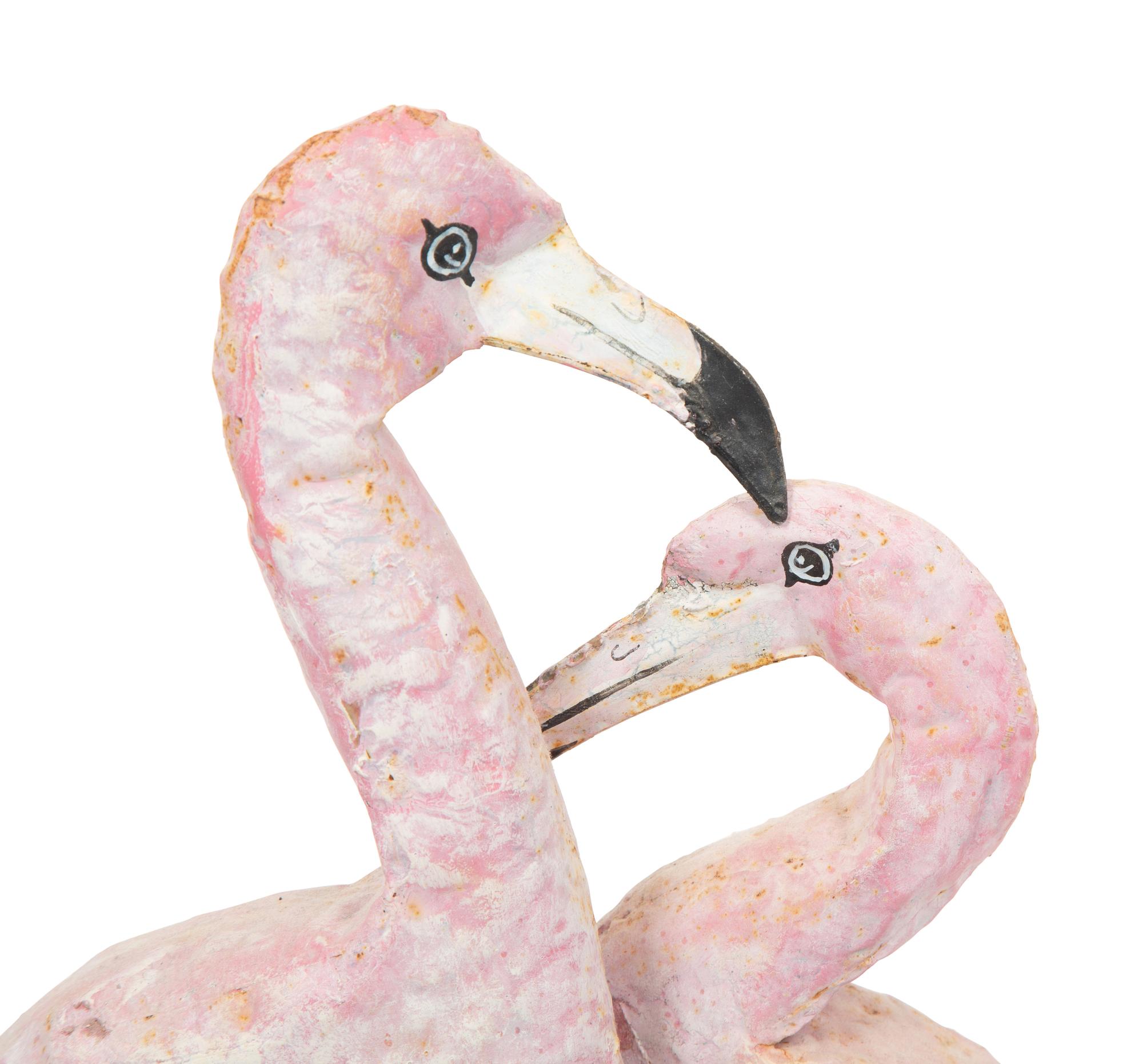 A Tole Peint Model of Two Flamingos and a Glazed Earthenware Model of a Flamingo