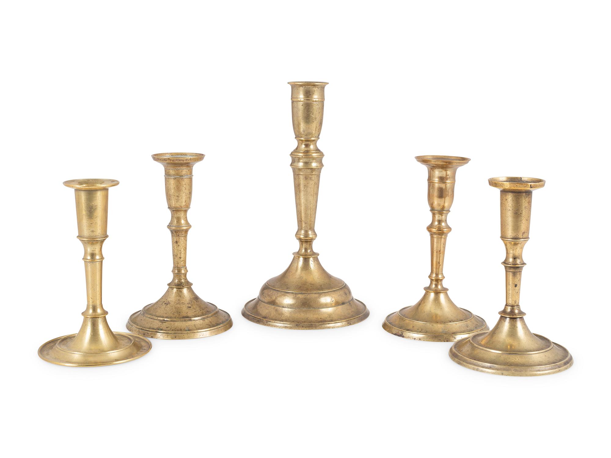 Five English Brass Circular Base Candlesticks