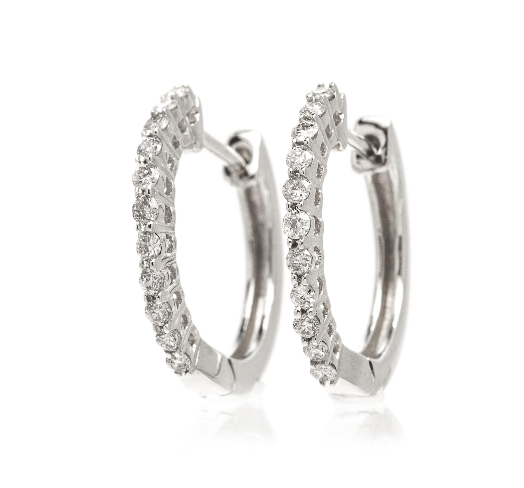A Pair Of 14 Karat White Gold and Diamond Hoop Earrings, 1.50 dwts.