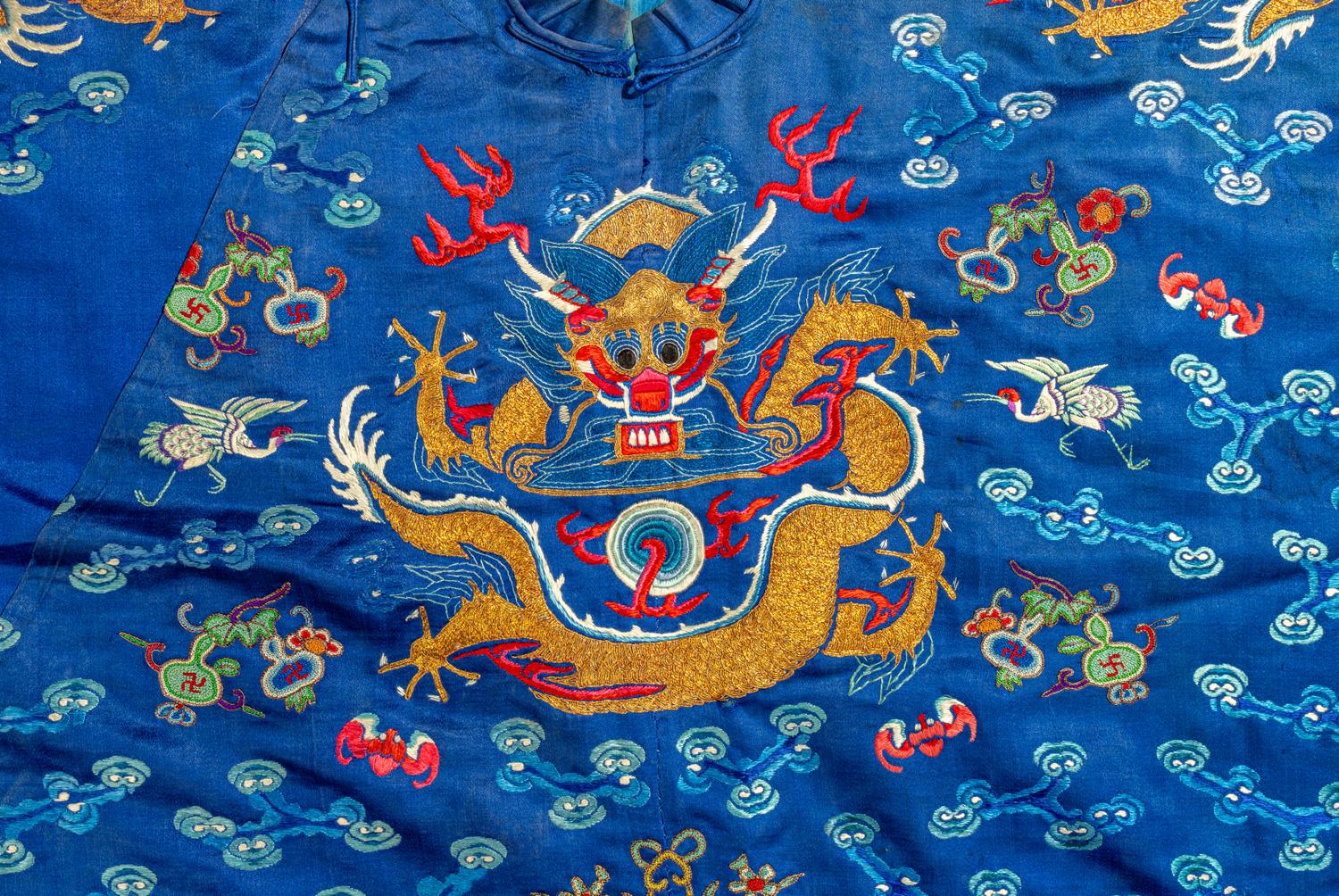 A Chinese Blue Ground Embroidered Silk 'Dragon' Robe
