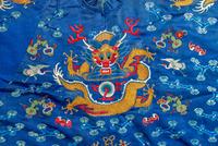 A Chinese Blue Ground Embroidered Silk 'Dragon' Robe