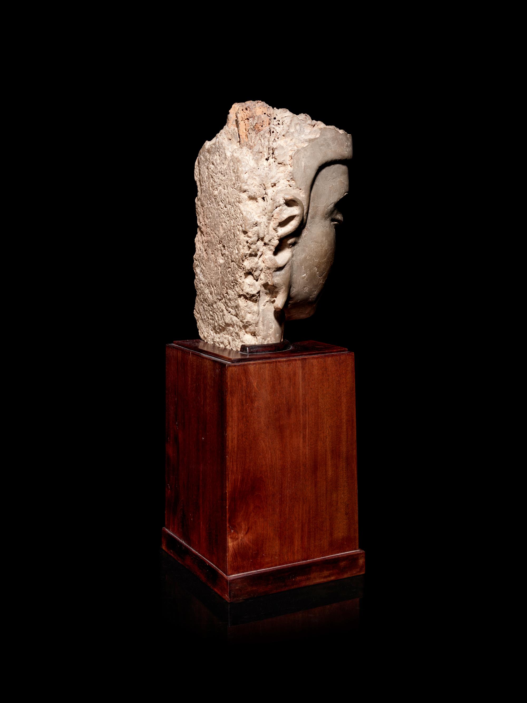 A Carved Stucco Head of Guanyin