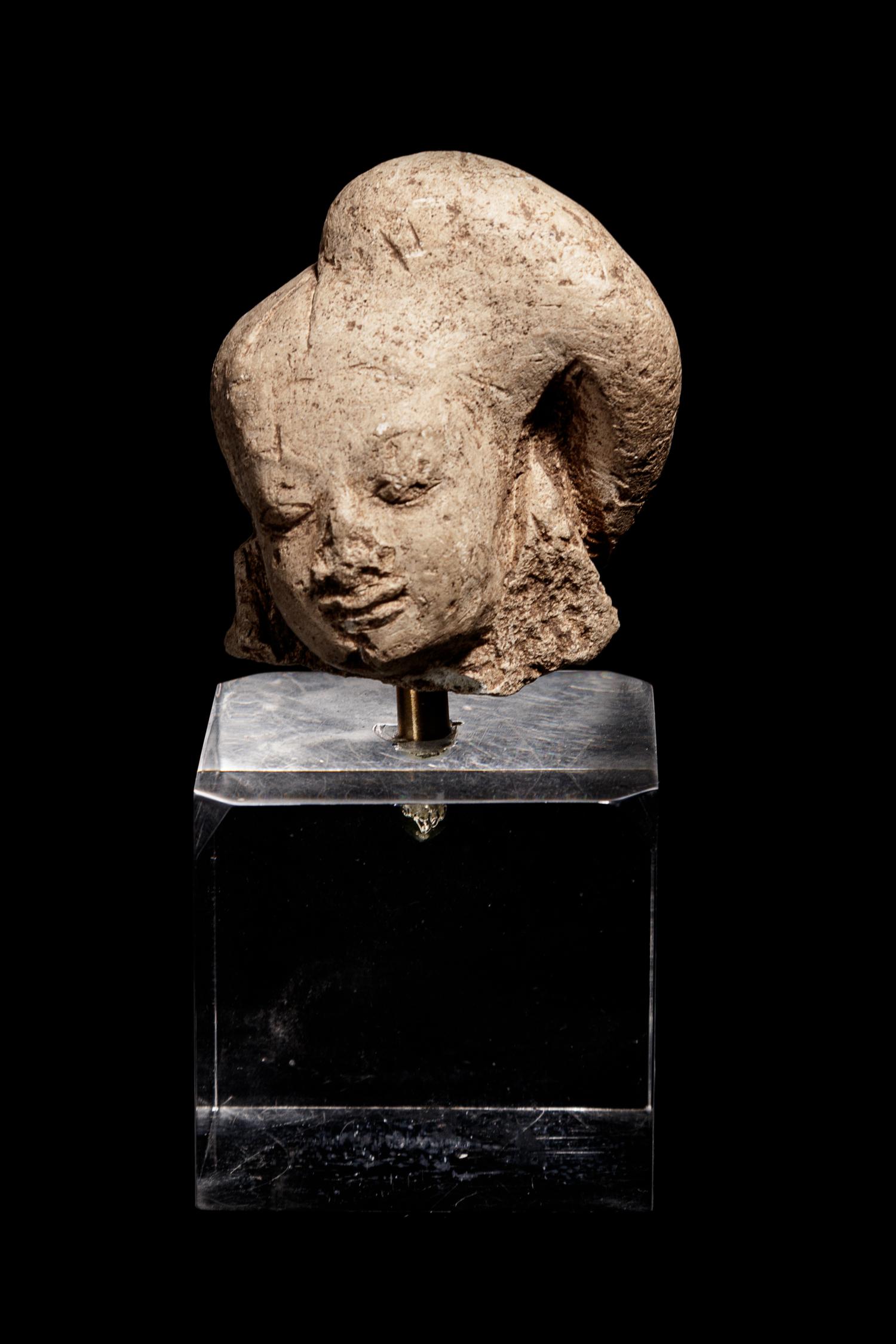 An Egyptian Terracotta Head of Harpokrates