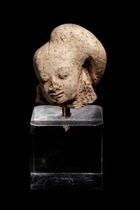 An Egyptian Terracotta Head of Harpokrates