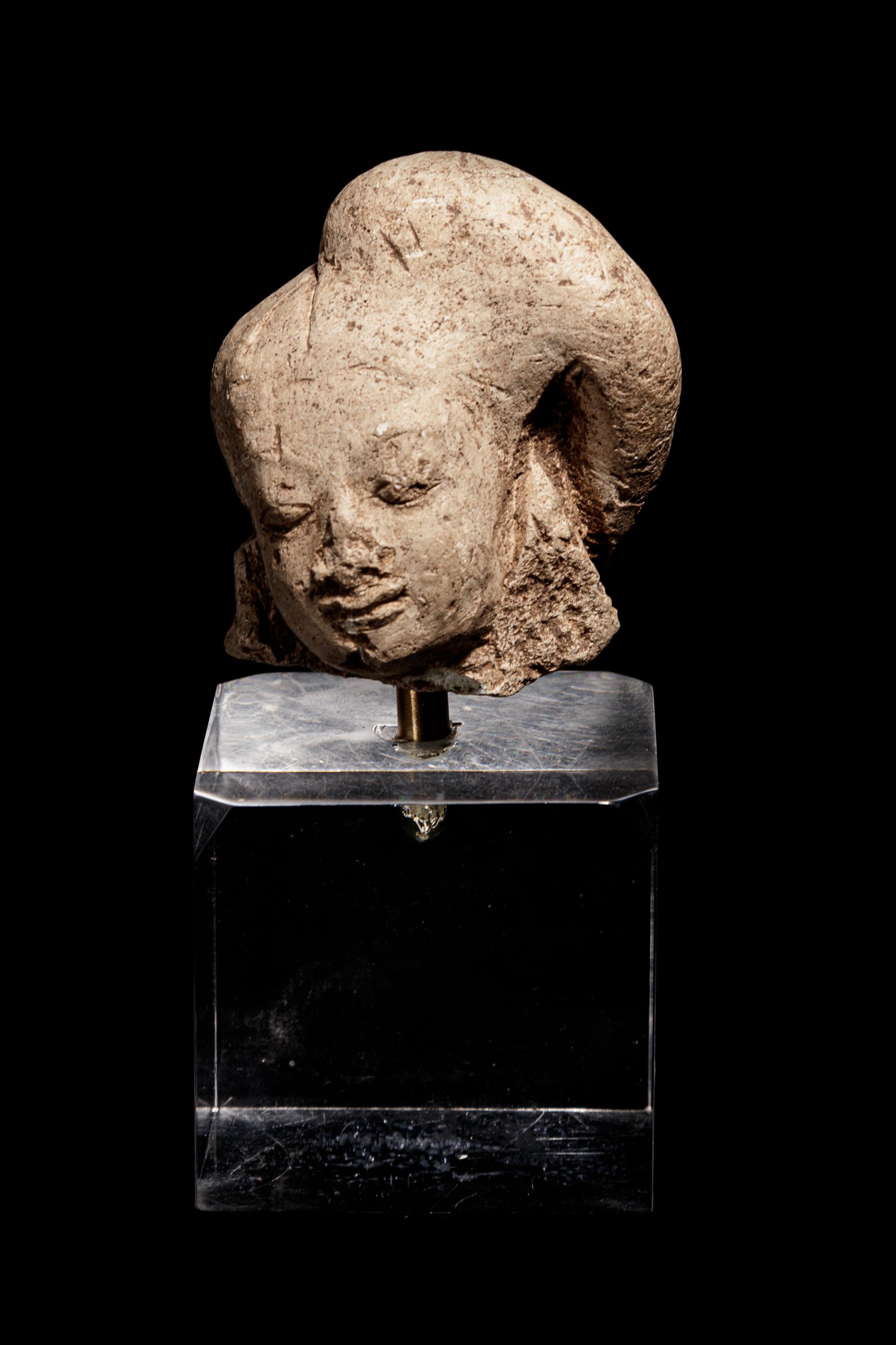 An Egyptian Terracotta Head of Harpokrates