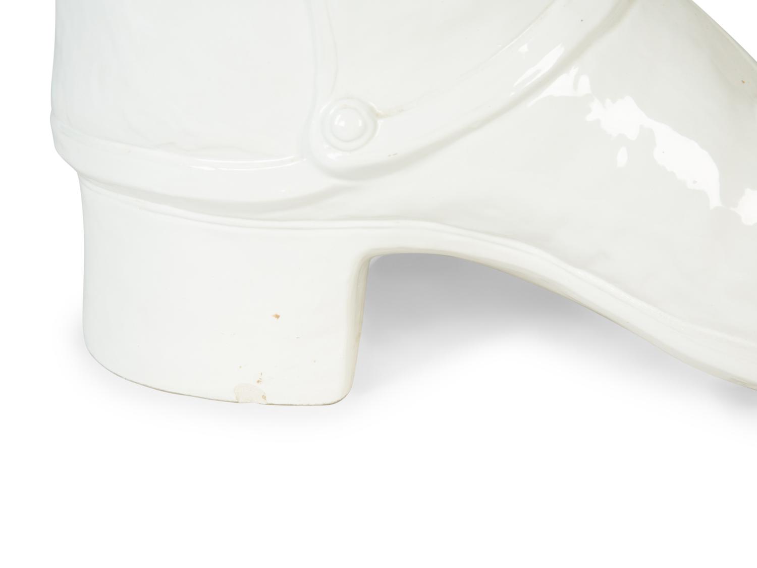 An Italian White-Glazed Earthenware Boot