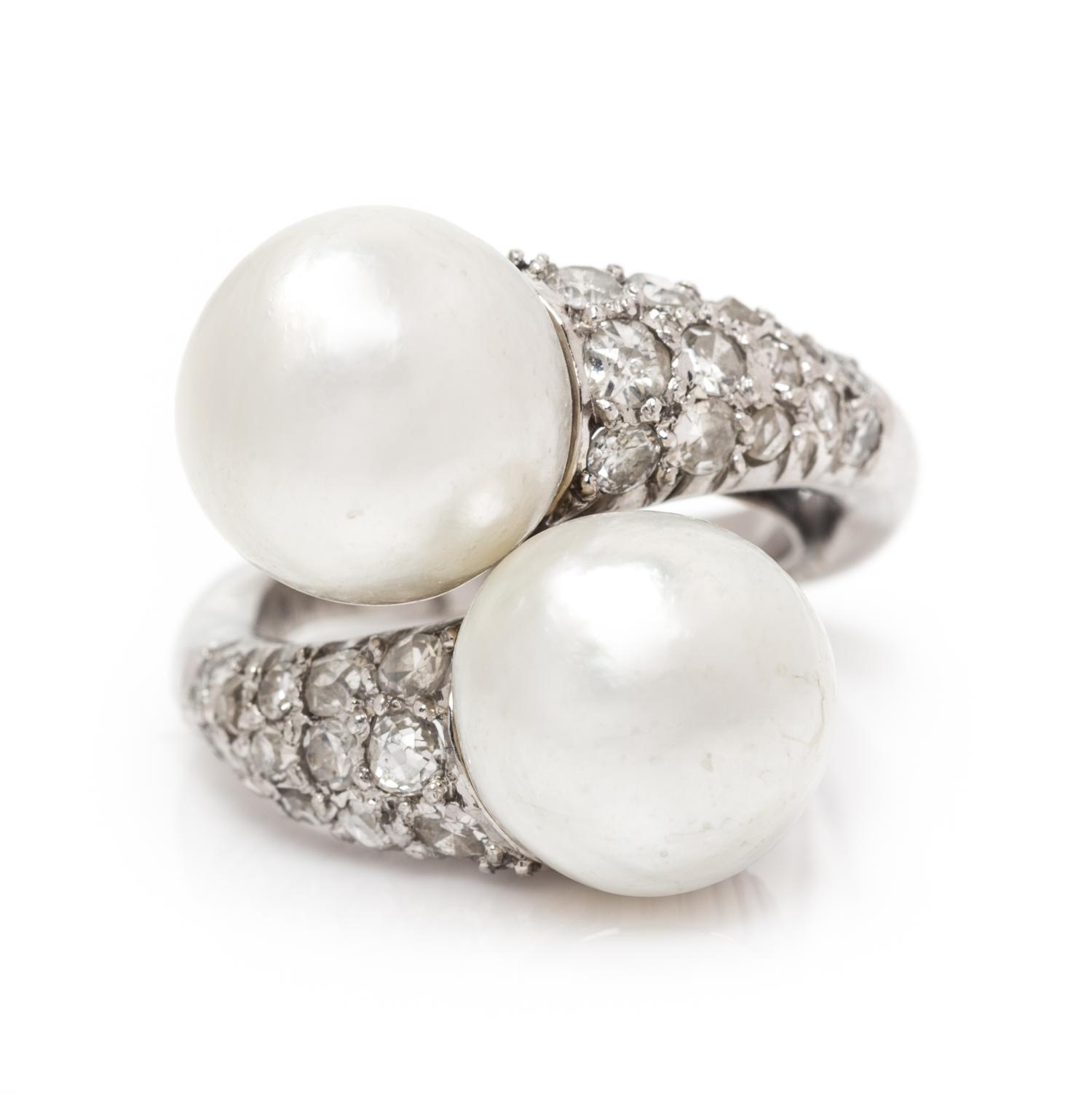 A Platinum, Pearl and Diamond Bypass Ring, 6.10 dwts.