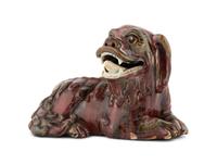A Chinese Flambe Glazed Porcelain Figure of a Fu Lion