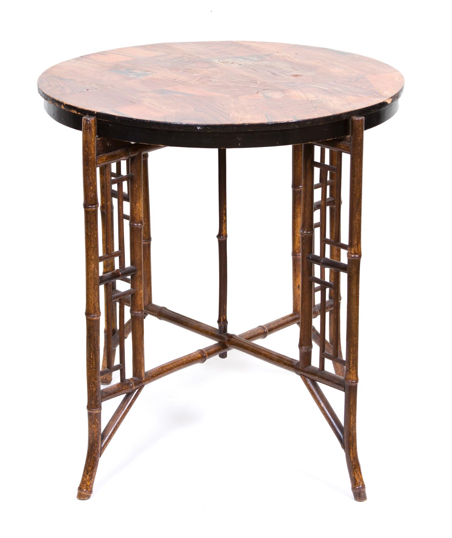 A Victorian Bamboo X-form Base Circular Table with Inlaid Top Height 24 1/2 x diameter 25 inches.