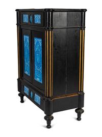 A Continental Blue Faience-Mounted Ebonized Cabinet