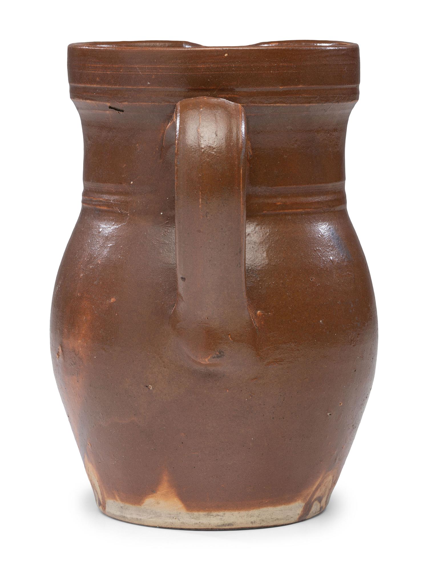 A P.H. Smith Albany Slip Stoneware Pitcher