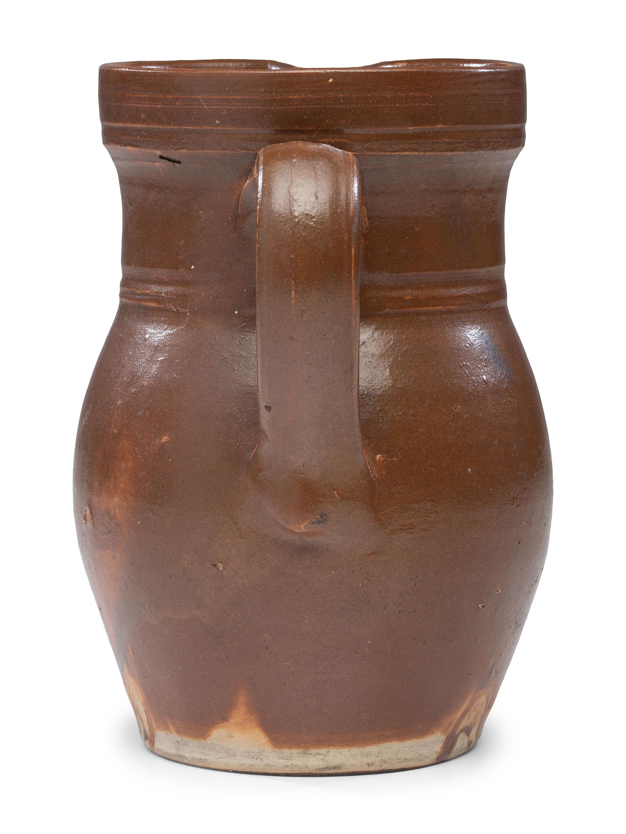 A P.H. Smith Albany Slip Stoneware Pitcher