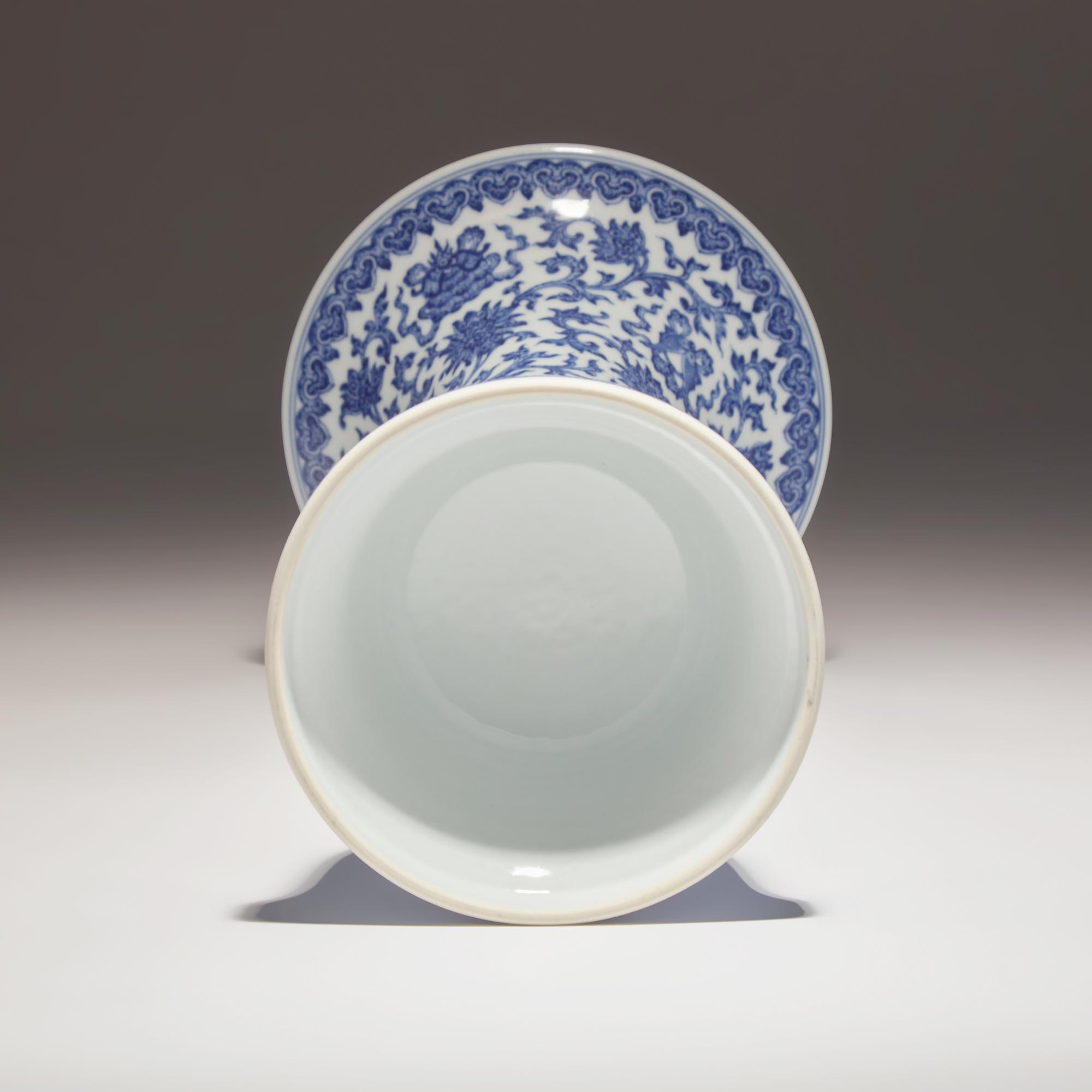 A Chinese Blue and White Porcelain Gu Vase, Jiaqing Mark and of the Period — 清嘉慶 青花纏枝蓮八吉祥花觚