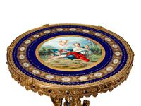 A Louis XVI Style Gilt-Bronze-Mounted Sevres Style Porcelain Gueridon
