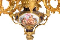 A Pair of Sèvres Style Porcelain and Gilt Bronze Nine-Light Chandeliers