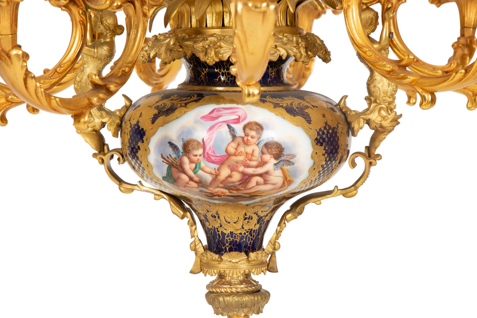 A Pair of Sèvres Style Porcelain and Gilt Bronze Nine-Light Chandeliers