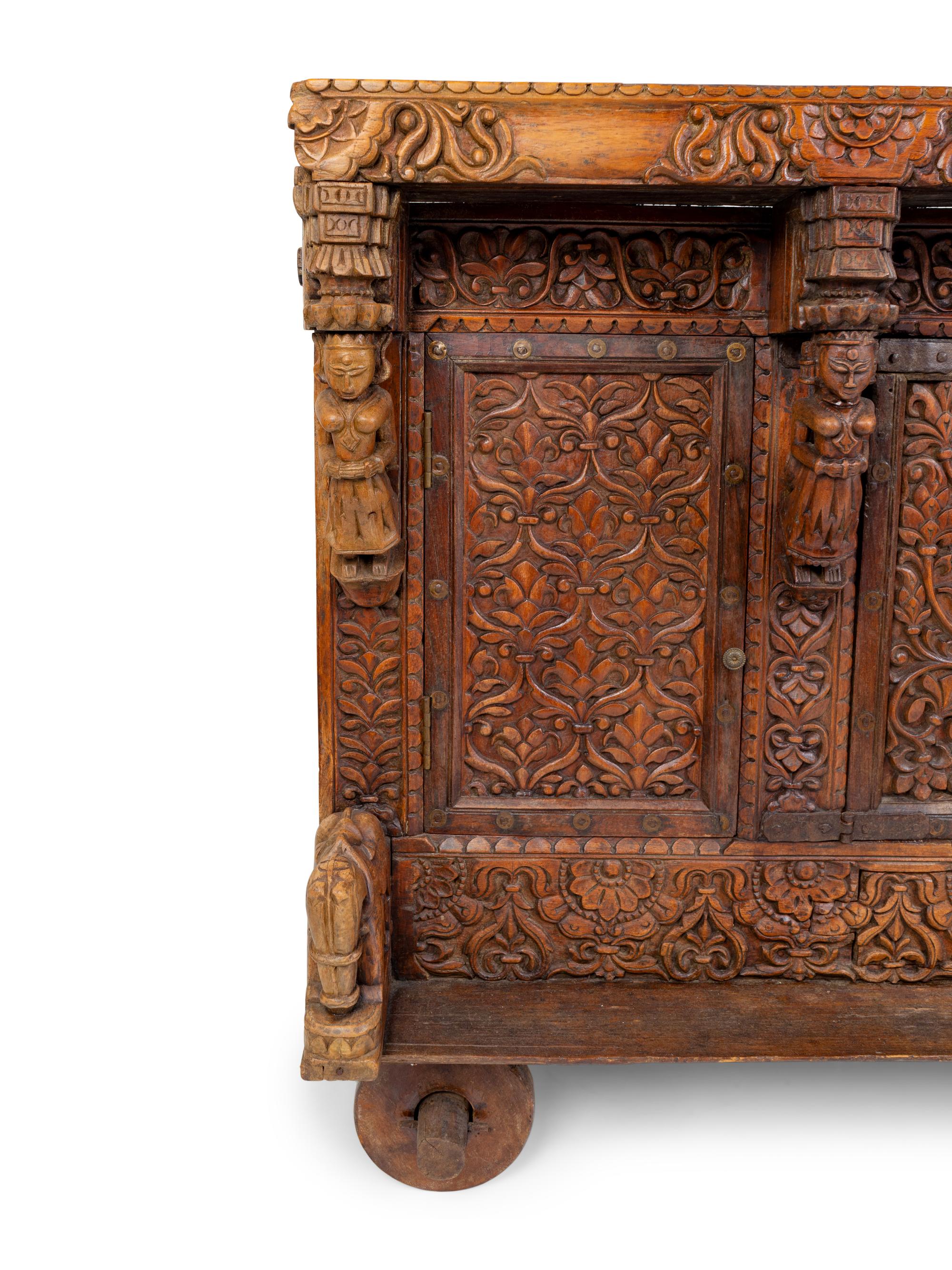 An Indian Carved Wood Traveling Trunk on Wheels — 19TH/20TH CENTURY