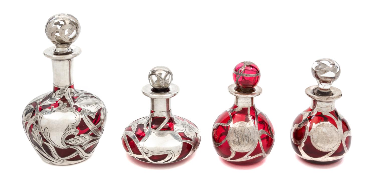 Four Silver Overlay Glass Perfume Bottles Height of tallest 5 inches.