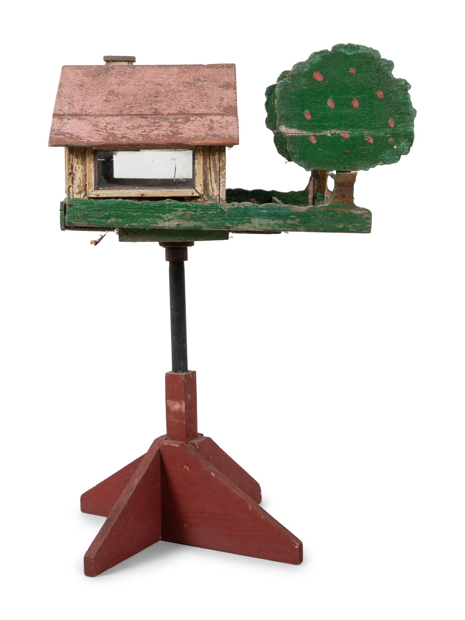 A Carved and Painted Wood Directional Tree and House Bird Feeder