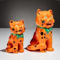 Clarice Cliff (English, 1899–1972) — Two Orange Laughing Cat Figures