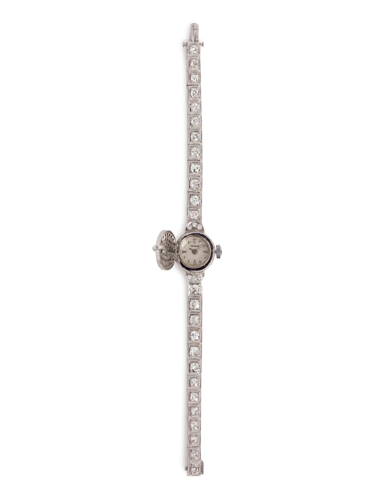 A 14 Karat White Gold and Diamond Surprise Wristwatch, Tessco,
