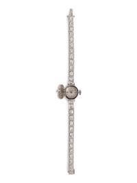 A 14 Karat White Gold and Diamond Surprise Wristwatch, Tessco,
