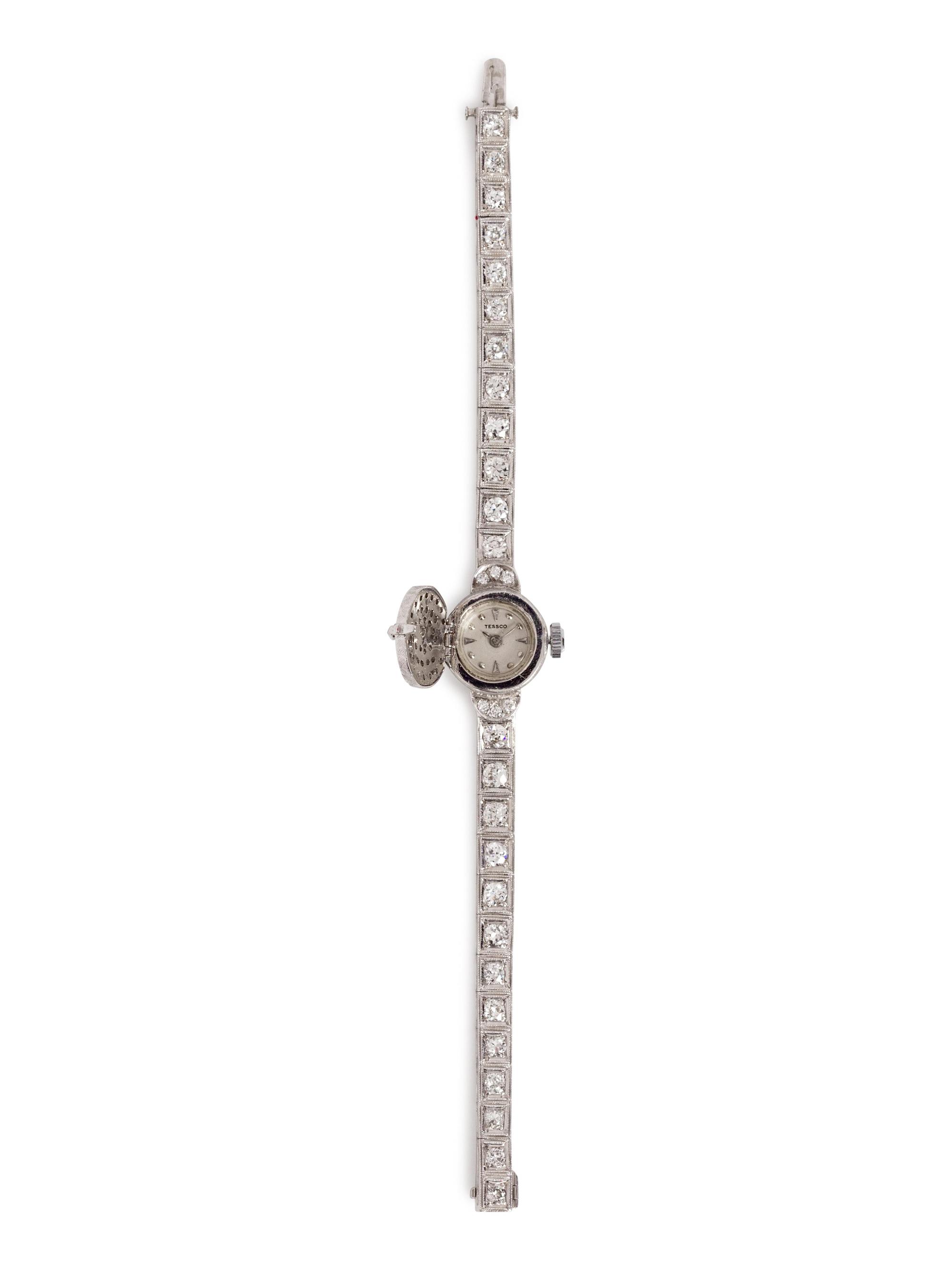A 14 Karat White Gold and Diamond Surprise Wristwatch, Tessco,