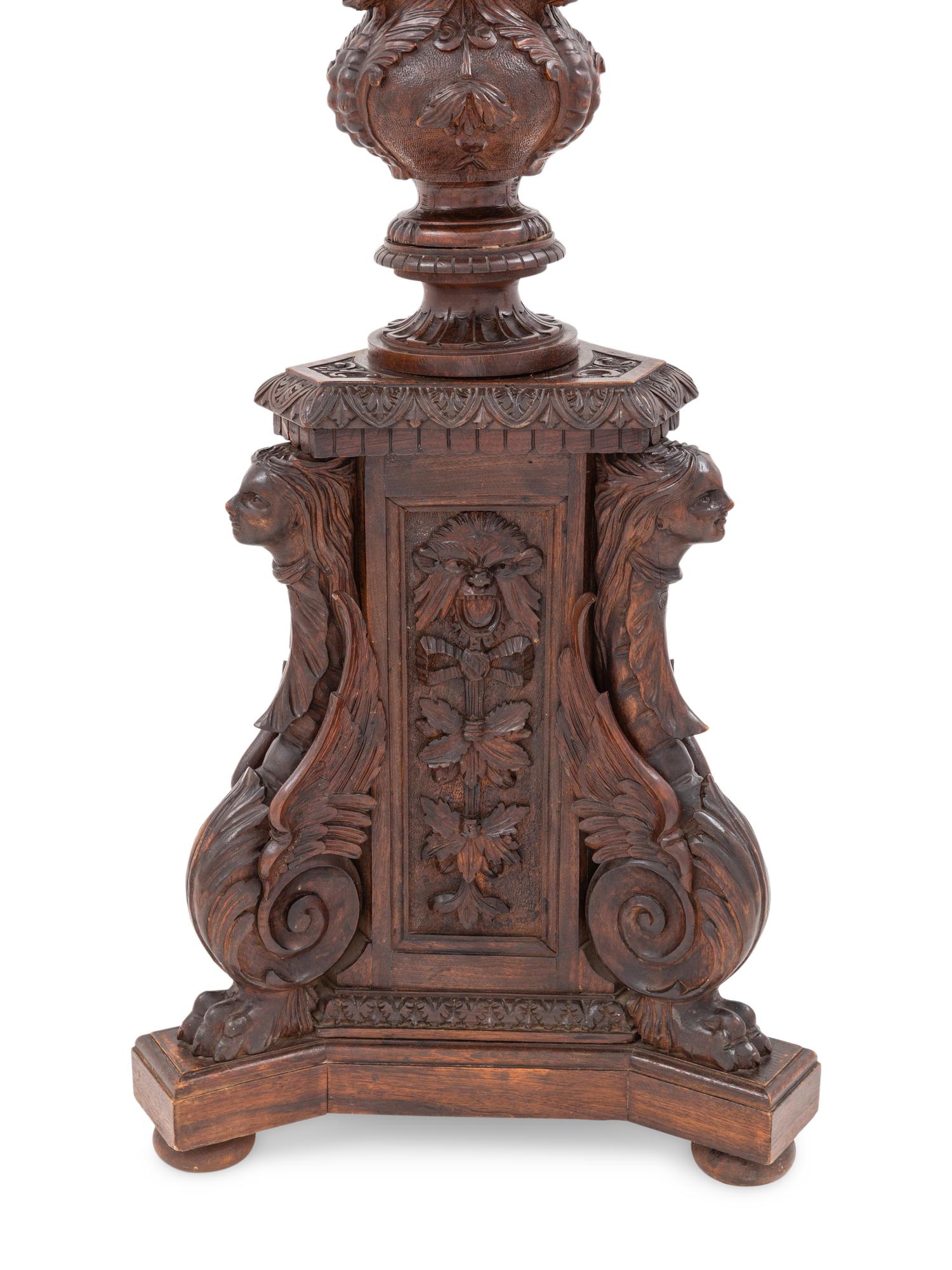 An Italian Carved Walnut Tripartite Pedestal