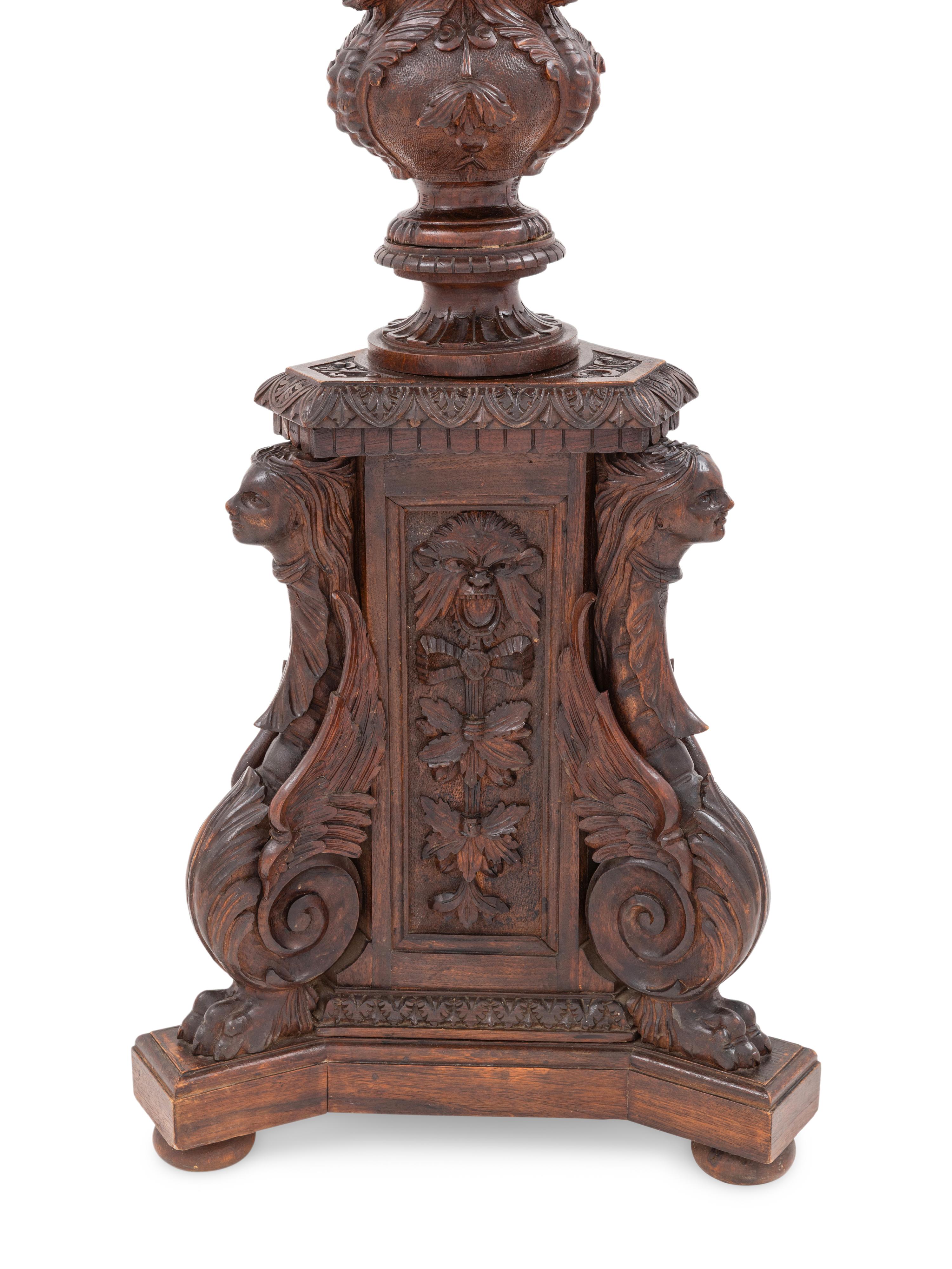 An Italian Carved Walnut Tripartite Pedestal