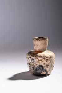An Islamic Dark Yellow Glass Flask