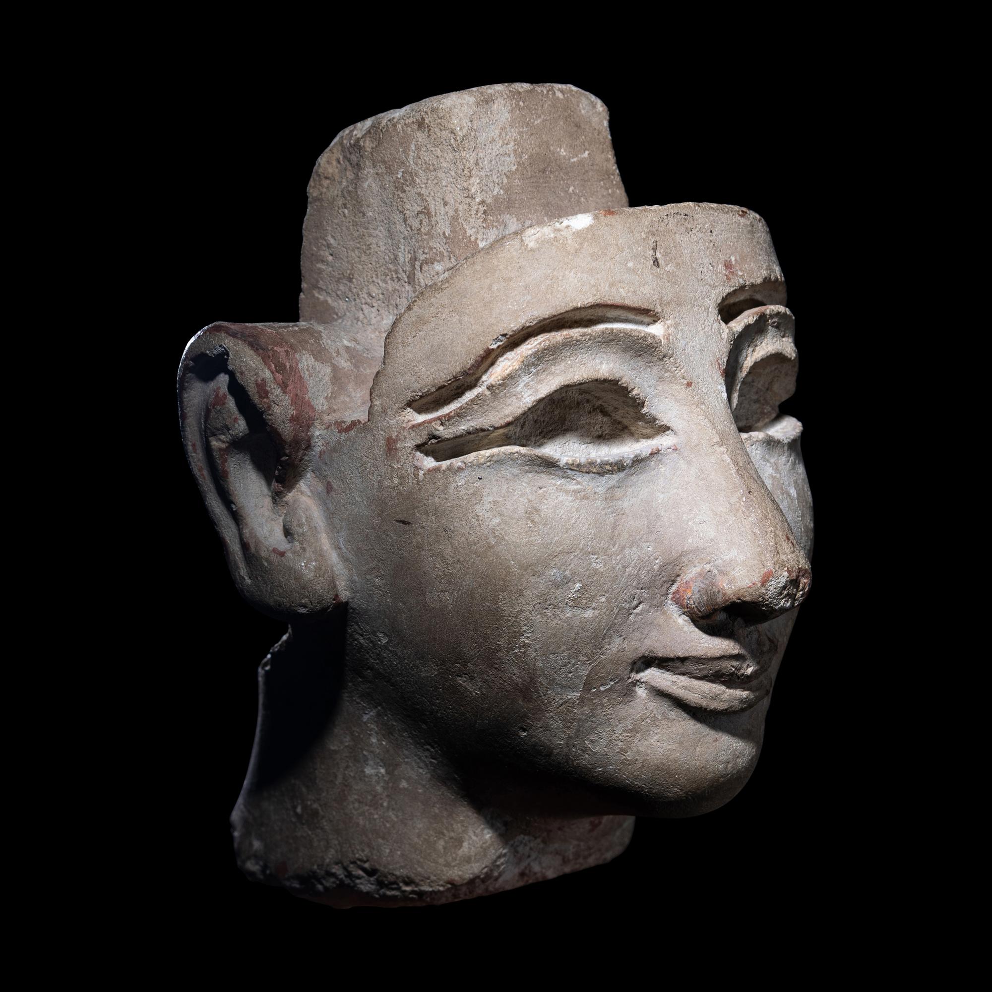 An Egyptian Limestone Head from a Composite Statue