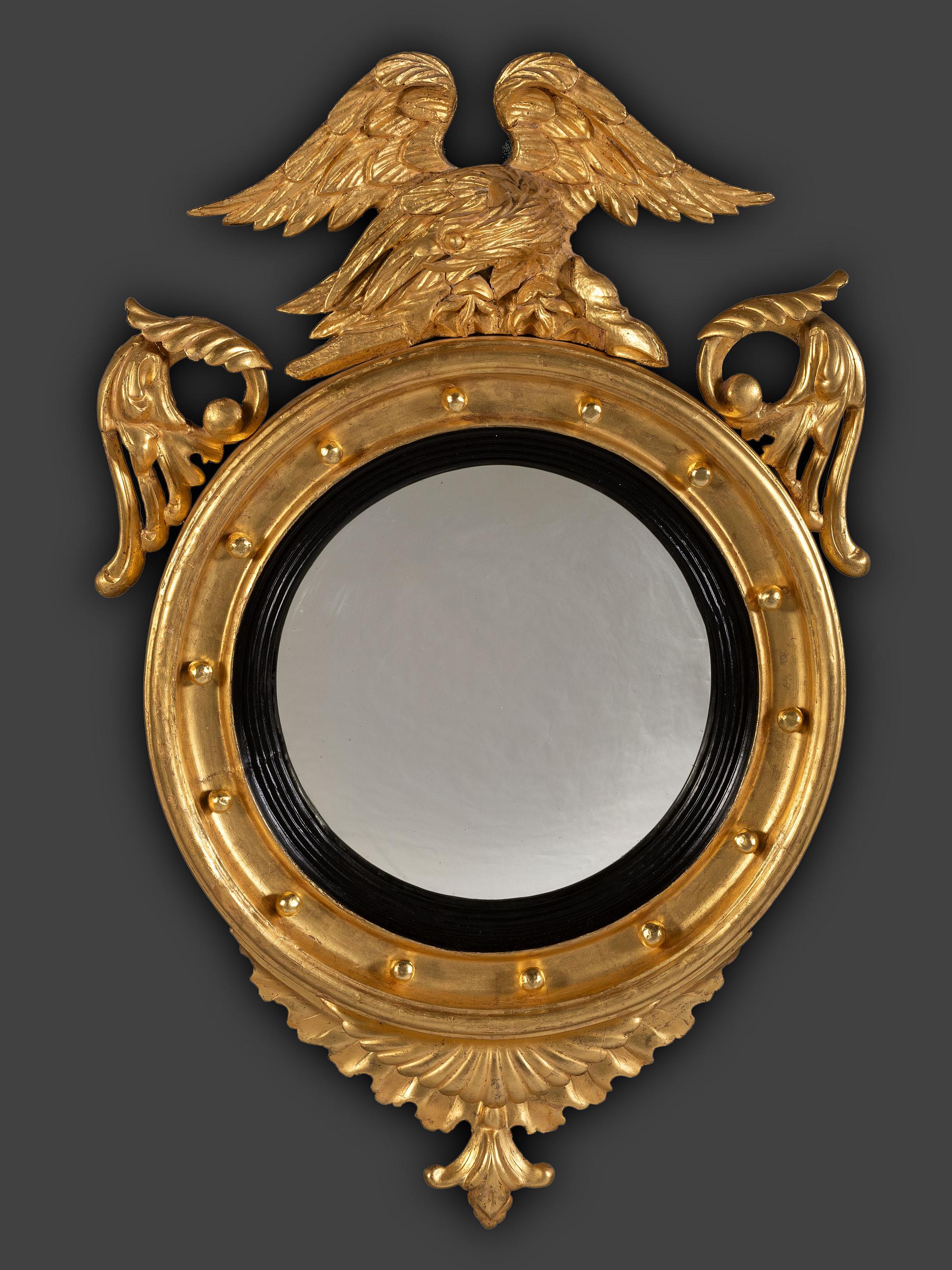 A Pair of Federal Giltwood Bull's Eye Looking Glasses