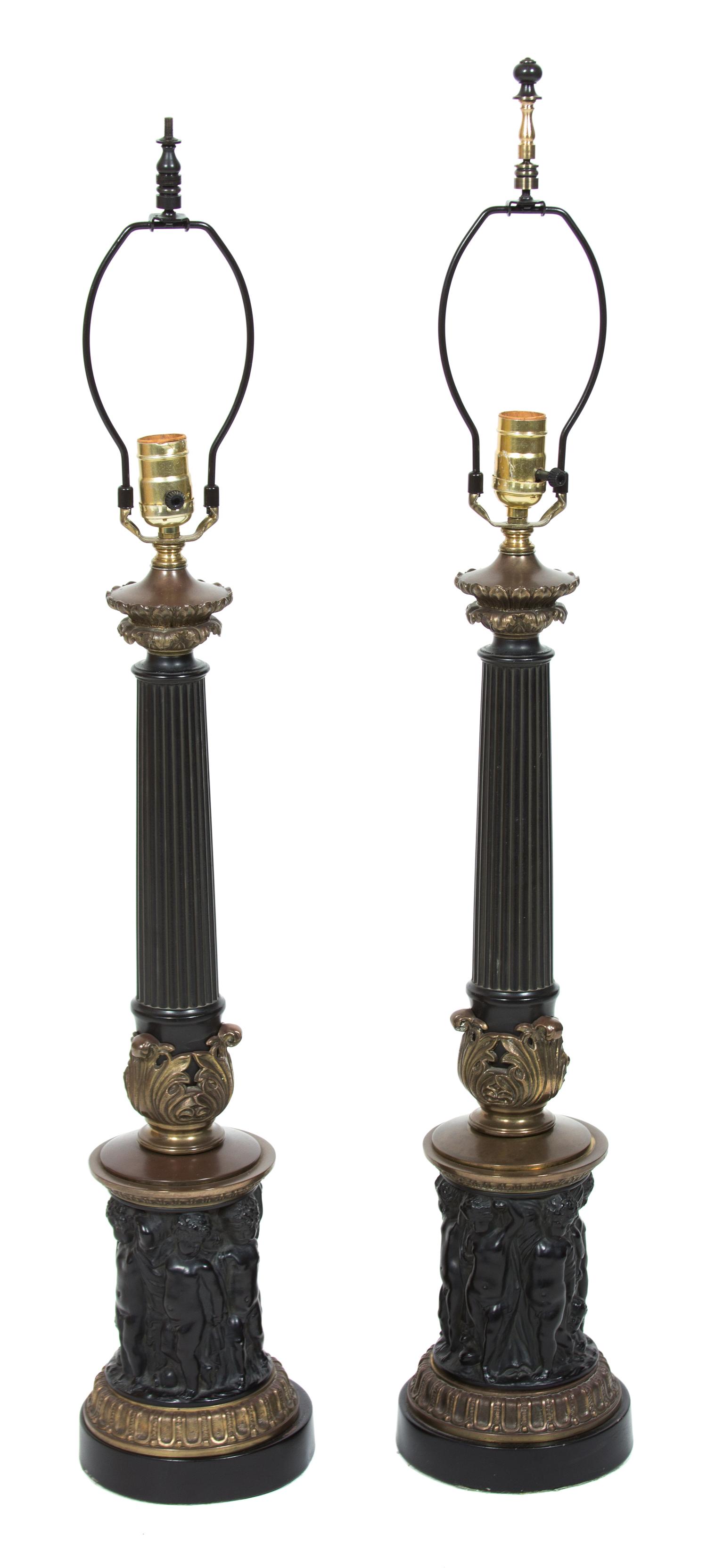 A Pair of Neoclassical Style Ebonized and Gilt Bronze Columnar Table Lamps Height 36 3/4 inches.