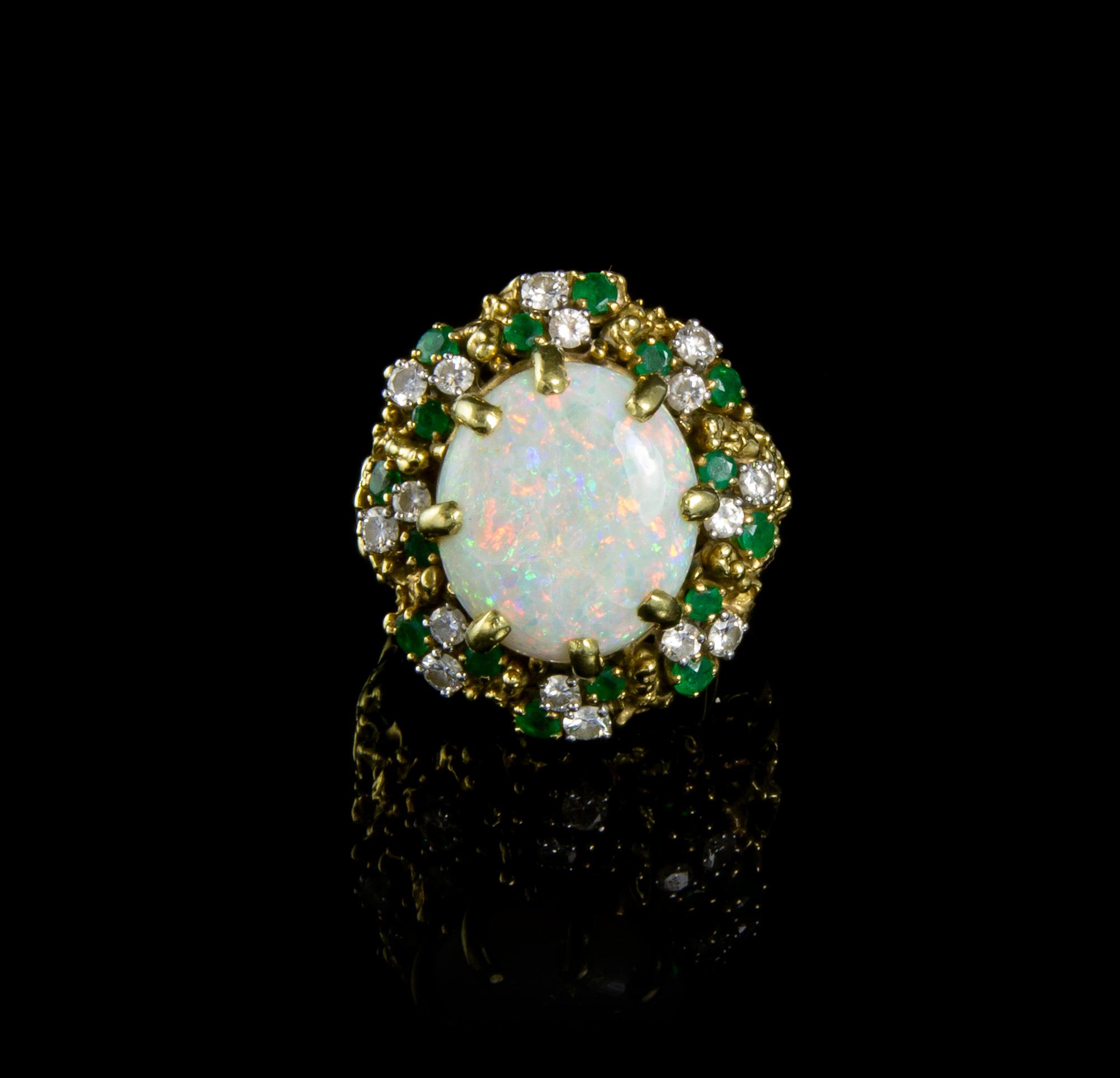 An 18 Karat Yellow Gold, Opal, Emerald and Diamond Ring, 17.70 dwts.