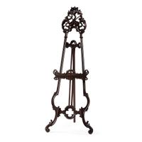 A Renaissance Revival Carved Walnut Musical Easel