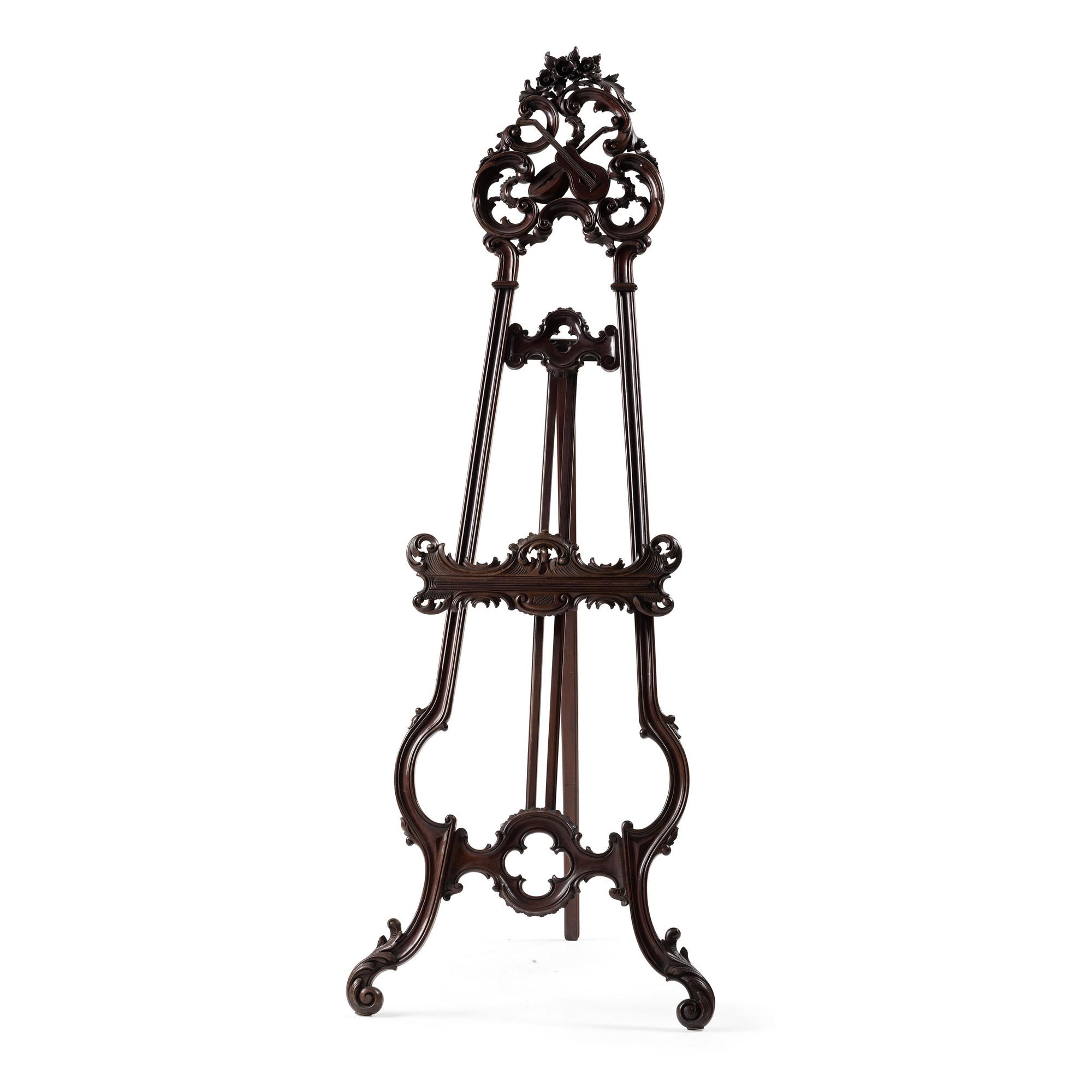 A Renaissance Revival Carved Walnut Musical Easel