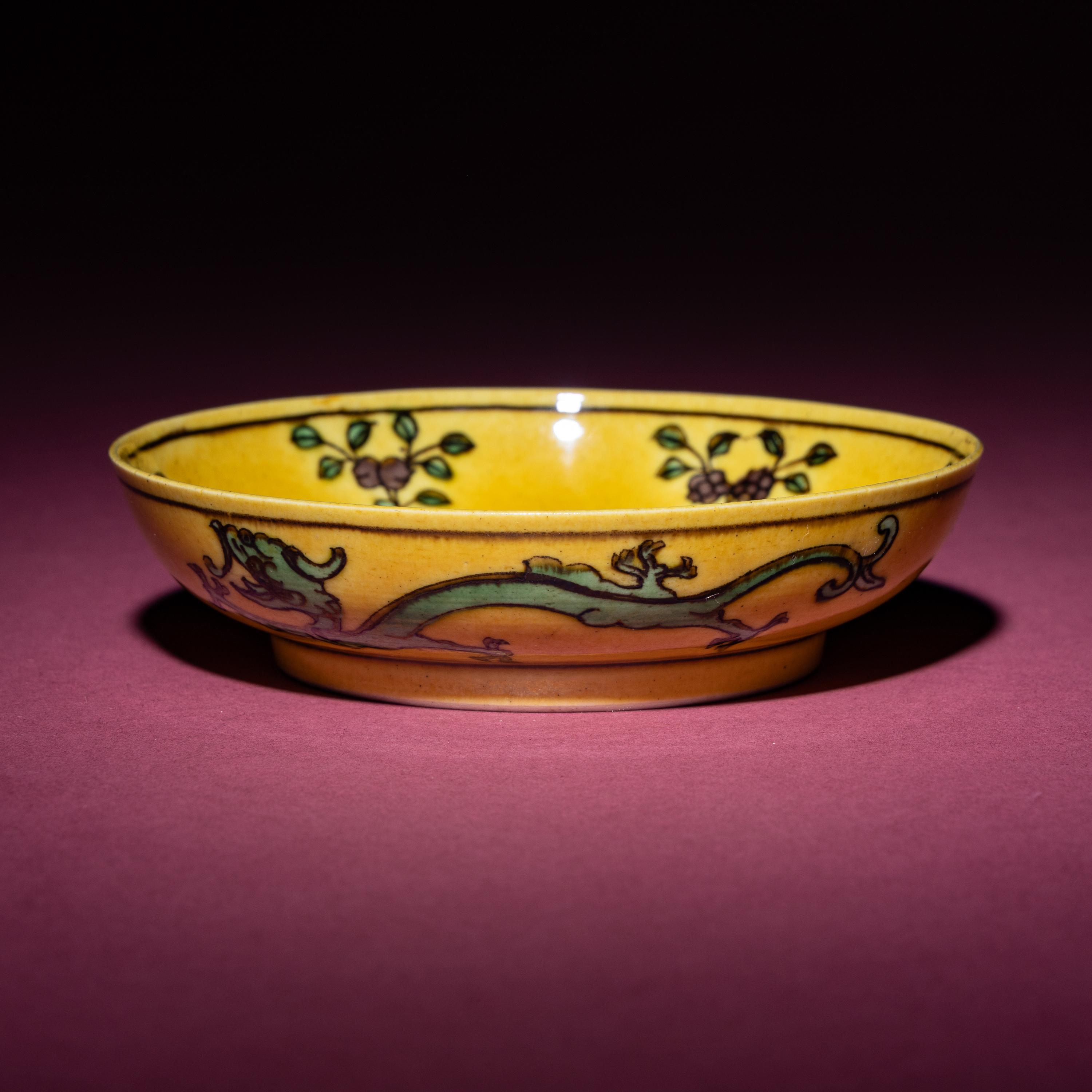 A Small Chinese Yellow Ground Green and Aubergine 'Dragon' Dish, Daoguang Mark and Period — 清道光 黃地紫綠彩雙龍戲珠紋碟