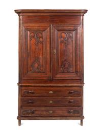 A Louis XV Carved Walnut Cabinet